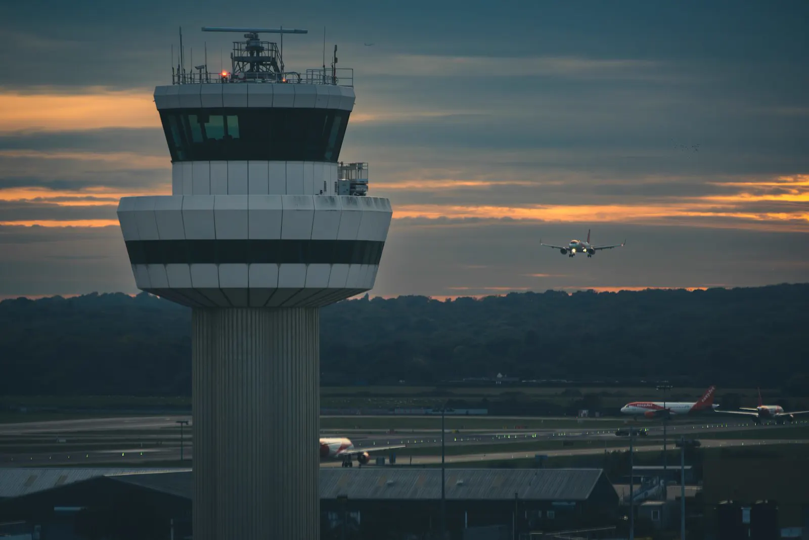 Gatwick Airport terminal forecourt with cars dropping off passengers